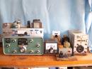 The Vintage Shack at KI5JF -  From left to right 
Heath SB310 Receiver with Homebrew 6AG7 & 6146 on top (Novice Rig from 1969) ;   Homebrew VFO  (MPF-102 and 2N2222’s )  -  built in an old battery charger chassis ;   Homebrew power supply ;  Navy “Flame – proof” key;   Recovered ARC-5 for 40Meters
